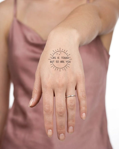INKY Resilient Sun semi-permanent tattoo applied on a woman – 2 x 2 in (4x4 cm) design, realistic ink look, lasts 10 days