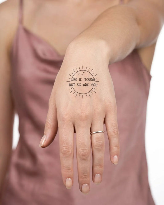 INKY Resilient Sun semi-permanent tattoo applied on a woman – 2 x 2 in (4x4 cm) design, realistic ink look, lasts 10 days