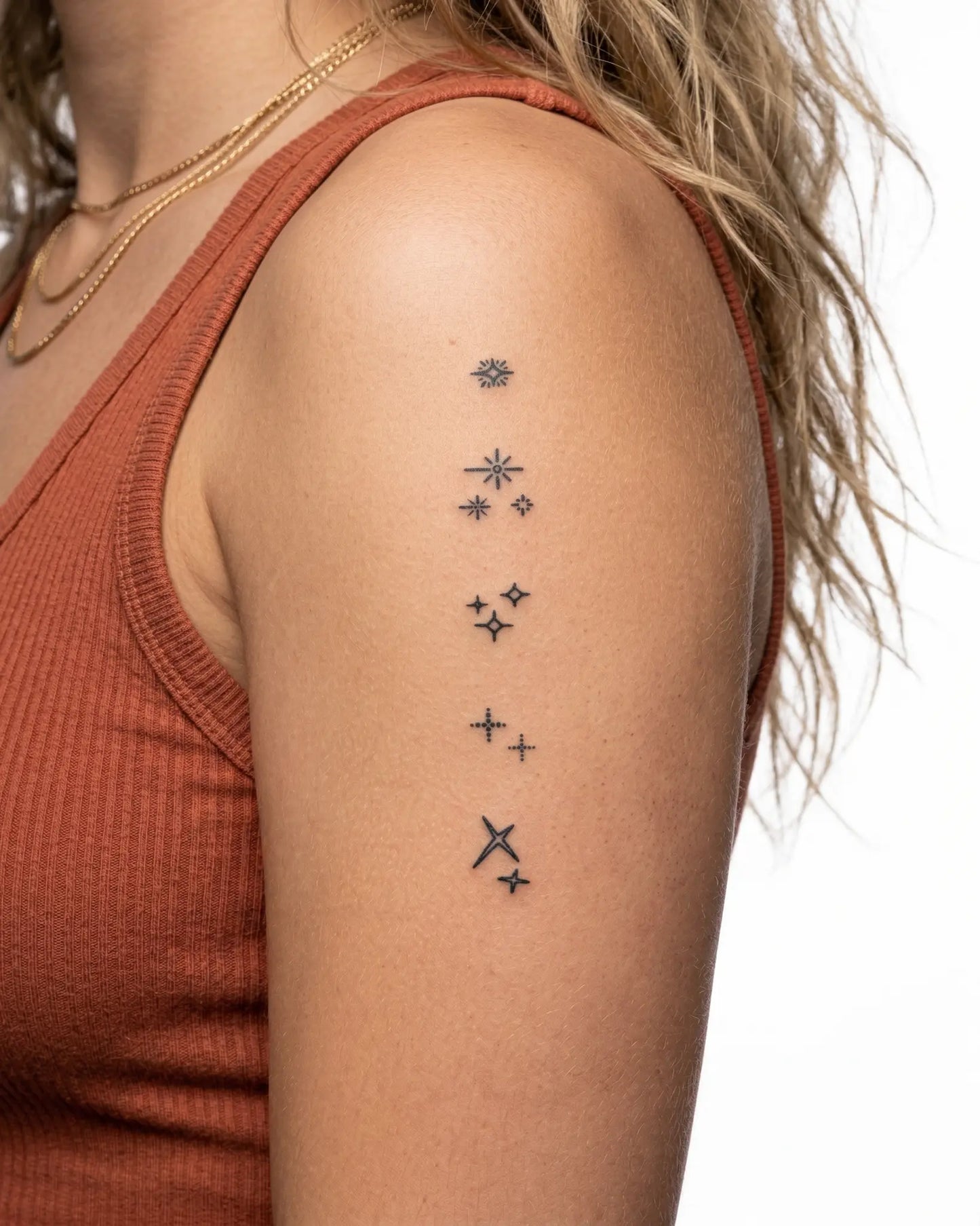 INKY Sparkles semi-permanent tattoo applied on a woman – 2 x 4 in (6x10 cm) design, realistic ink look, lasts 10 days
