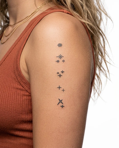 INKY Sparkles semi-permanent tattoo applied on a woman – 2 x 4 in (6x10 cm) design, realistic ink look, lasts 10 days