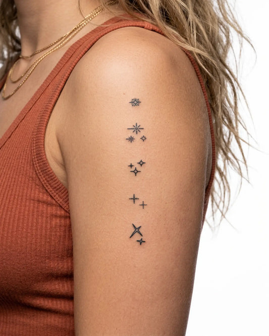 INKY Sparkles semi-permanent tattoo applied on a woman – 2 x 4 in (6x10 cm) design, realistic ink look, lasts 10 days