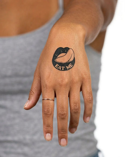 INKY Eat Me Lips semi-permanent tattoo applied on a woman – 2 x 2 in (4x4 cm) design, realistic ink look, lasts 10 days