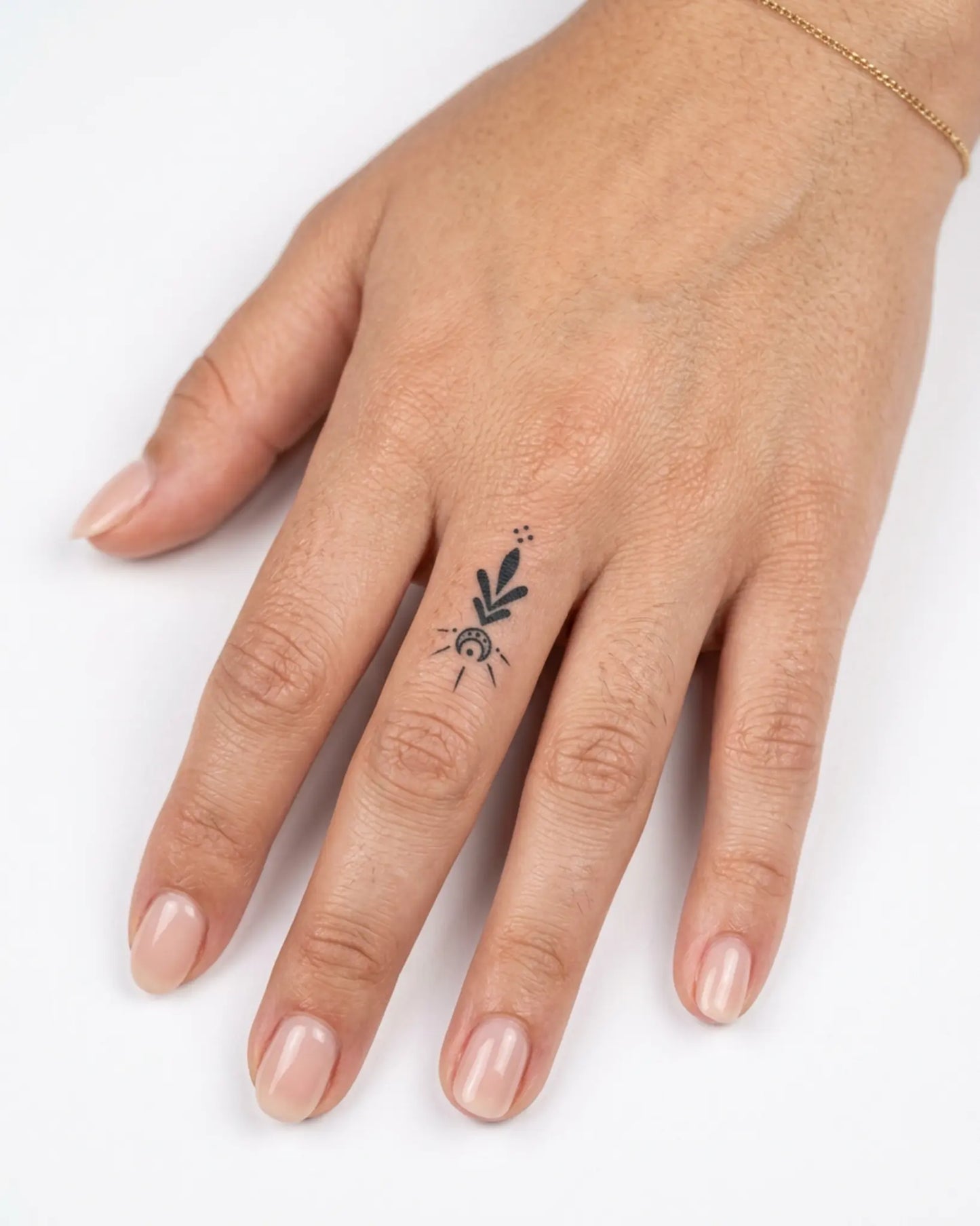 INKY Mystic Arrow semi-permanent tattoo applied on a woman – 0.5 x 0.5 in (1x1 cm) design, realistic ink look, lasts 10 days