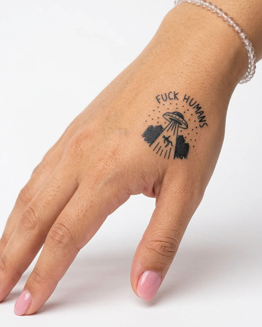 INKY Fck Humans semi-permanent tattoo applied on a woman – 2 x 2 in (4x4 cm) design, realistic ink look, lasts 10 days