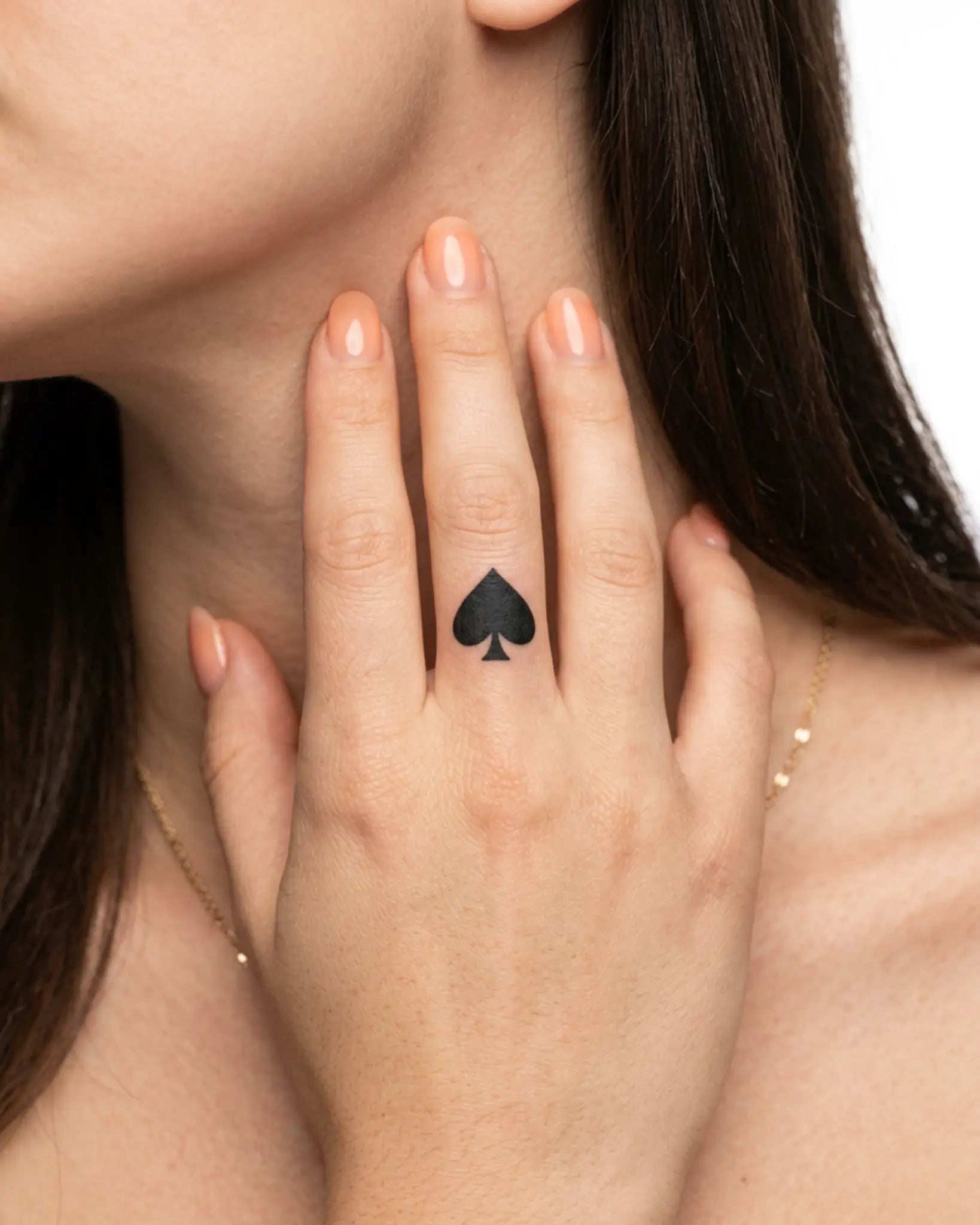 INKY Ace Spade semi-permanent tattoo applied on a woman – 0.5 x 0.5 in (1x1 cm) design, realistic ink look, lasts 10 days