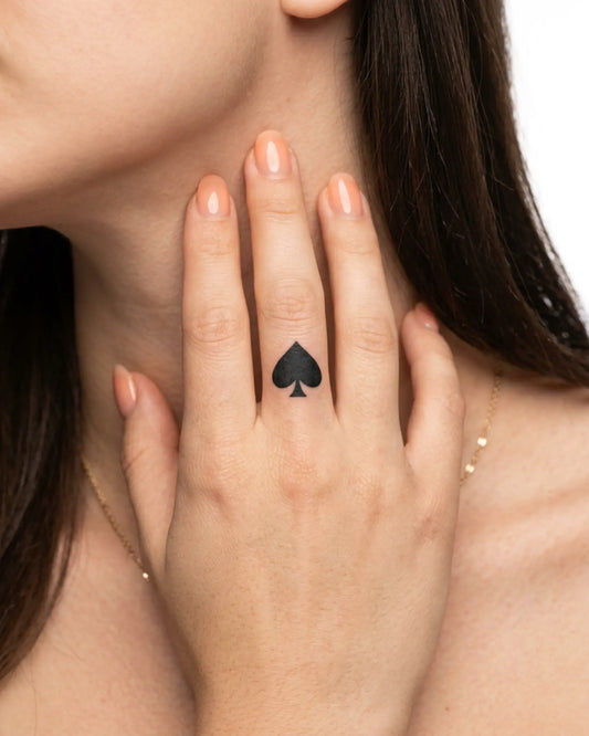INKY Ace Spade semi-permanent tattoo applied on a woman – 0.5 x 0.5 in (1x1 cm) design, realistic ink look, lasts 10 days