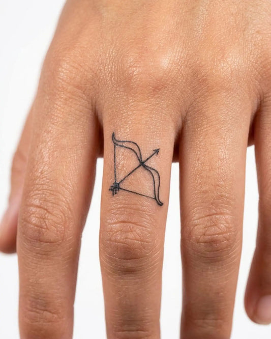 INKY Archer semi-permanent tattoo applied on a woman – 0.5 x 0.5 in (1x1 cm) design, realistic ink look, lasts 10 days