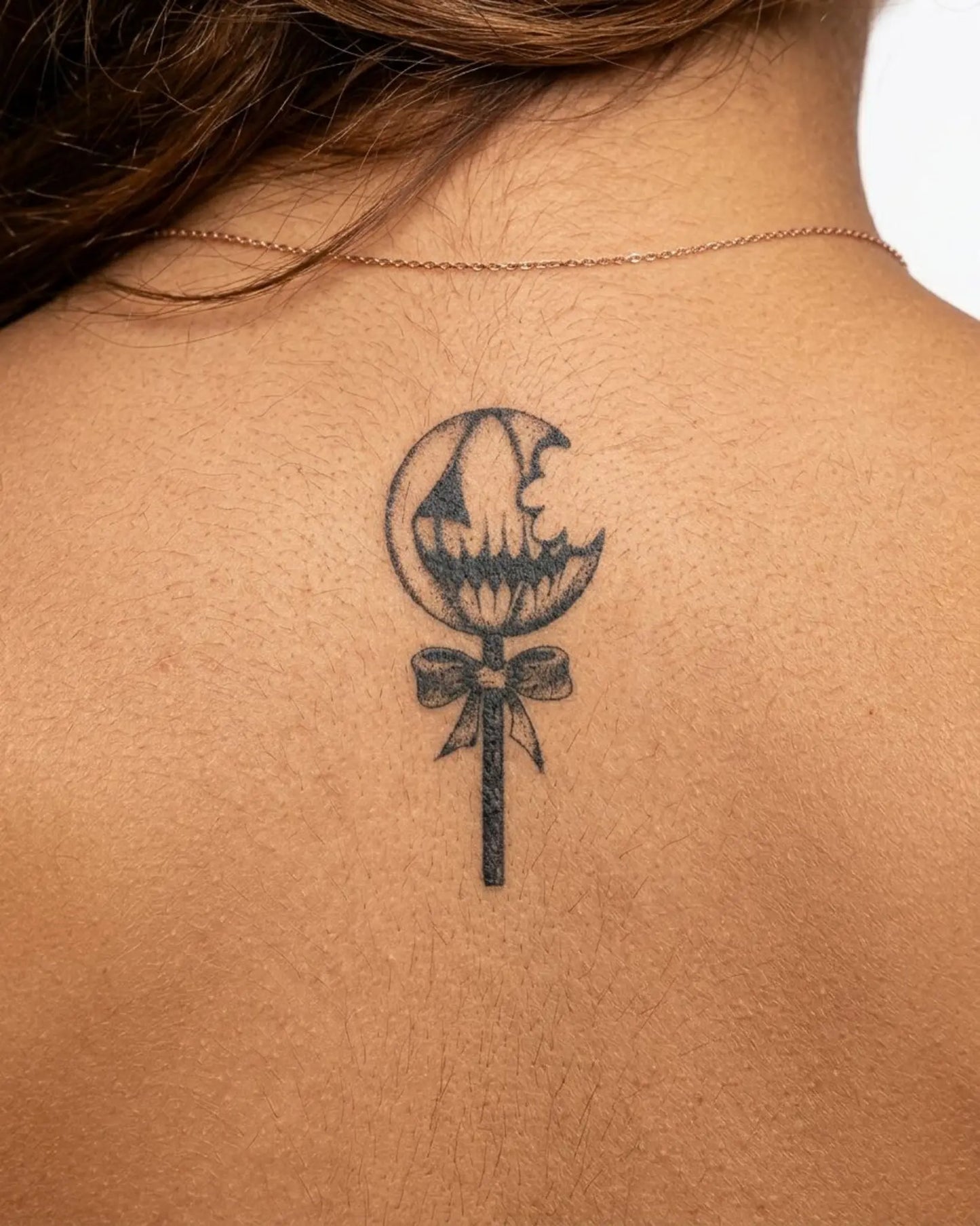 INKY Spooky Pop semi-permanent tattoo applied on a woman – 2 x 4 in (6x10 cm) design, realistic ink look, lasts 10 days