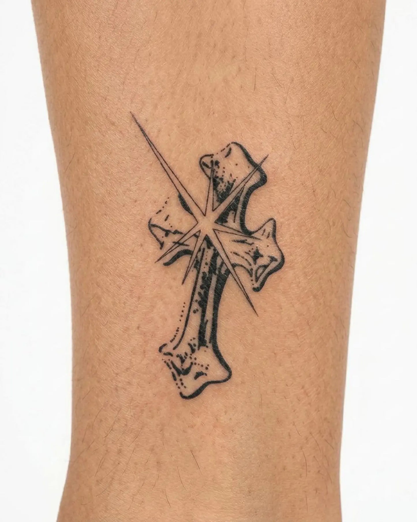 INKY Star Cross semi-permanent tattoo applied on a woman – 3 x 4 in (7x10 cm) design, realistic ink look, lasts 10 days