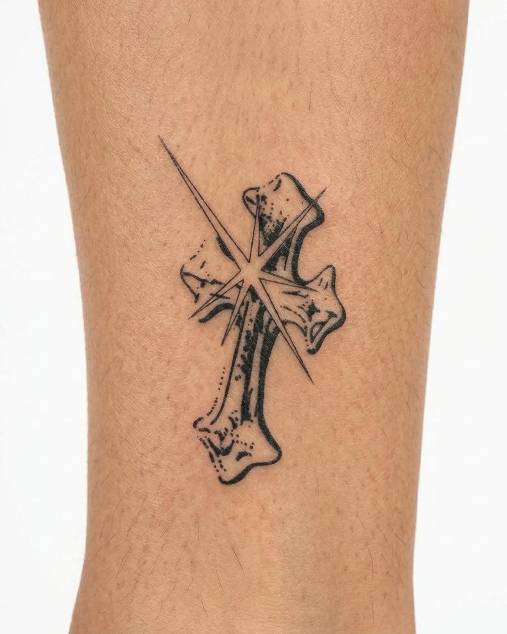 INKY Star Cross semi-permanent tattoo applied on a woman – 3 x 4 in (7x10 cm) design, realistic ink look, lasts 10 days