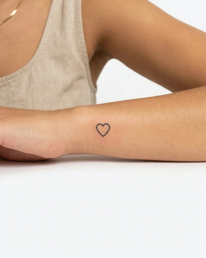 INKY Simple Heart semi-permanent tattoo applied on a woman – 0.5 x 0.5 in (1x1 cm) design, realistic ink look, lasts 10 days
