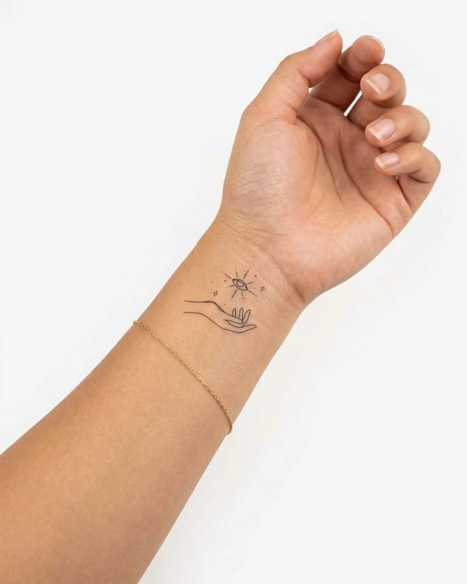 INKY Cosmic Hand semi-permanent tattoo applied on a woman – 2 x 2 in (4x4 cm) design, realistic ink look, lasts 10 days