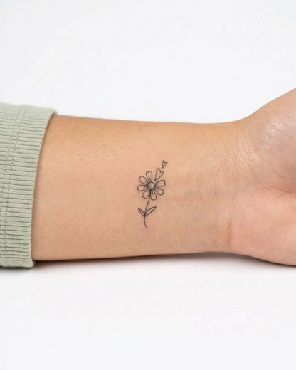 INKY Daisy Love semi-permanent tattoo applied on a woman – 0.5 x 0.5 in (1x1 cm) design, realistic ink look, lasts 10 days