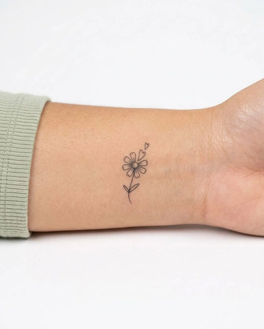 INKY Daisy Love semi-permanent tattoo applied on a woman – 0.5 x 0.5 in (1x1 cm) design, realistic ink look, lasts 10 days