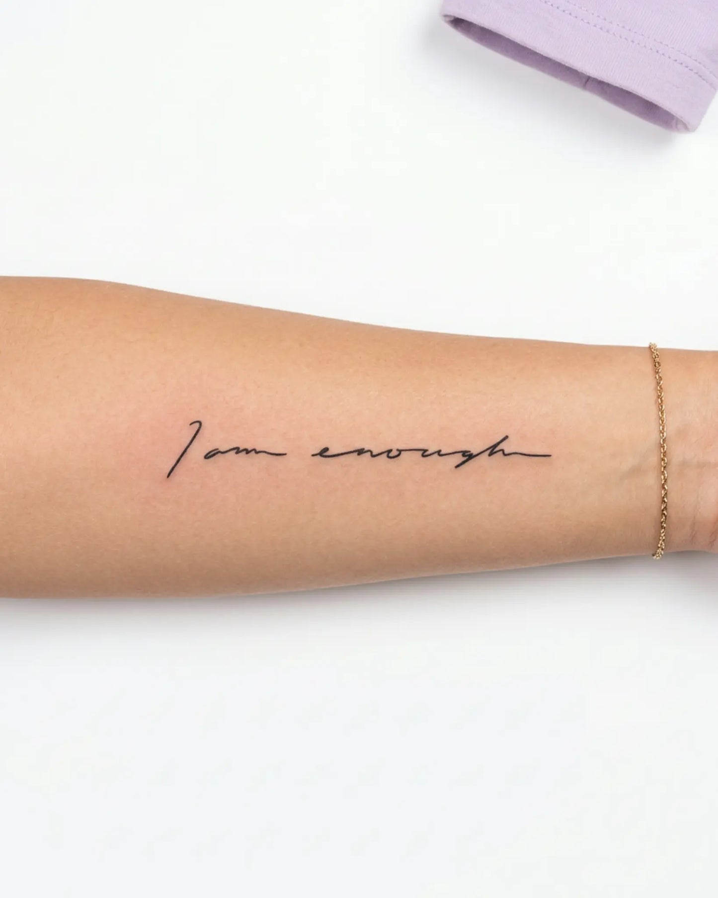 INKY I Am Enough semi-permanent tattoo applied on a woman – 2 x 4 in (6x10 cm) design, realistic ink look, lasts 10 days