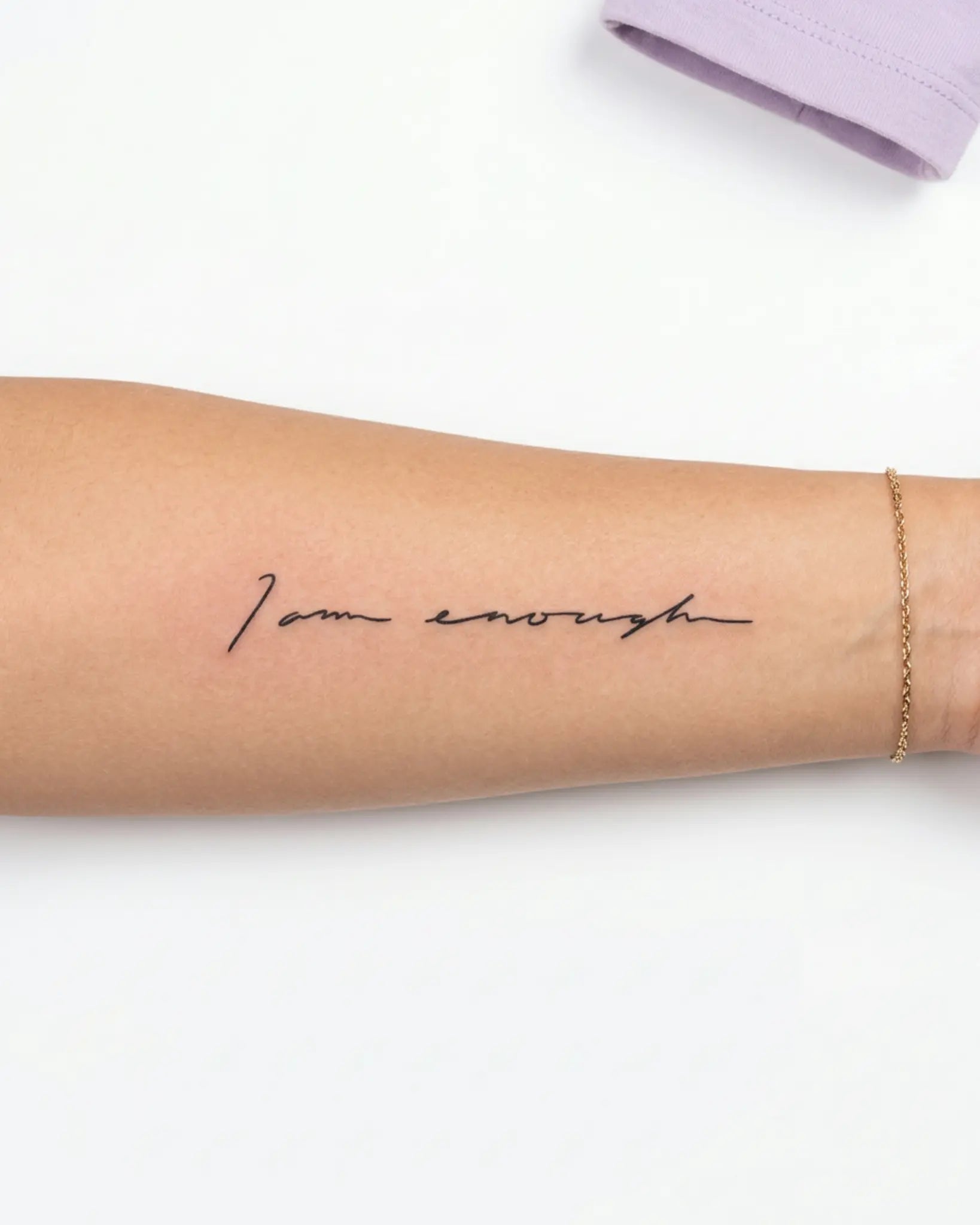 INKY I Am Enough semi-permanent tattoo applied on a woman – 2 x 4 in (6x10 cm) design, realistic ink look, lasts 10 days