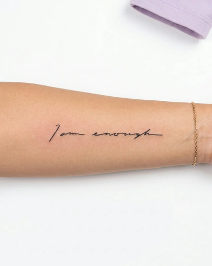 INKY I Am Enough semi-permanent tattoo applied on a woman – 2 x 4 in (6x10 cm) design, realistic ink look, lasts 10 days