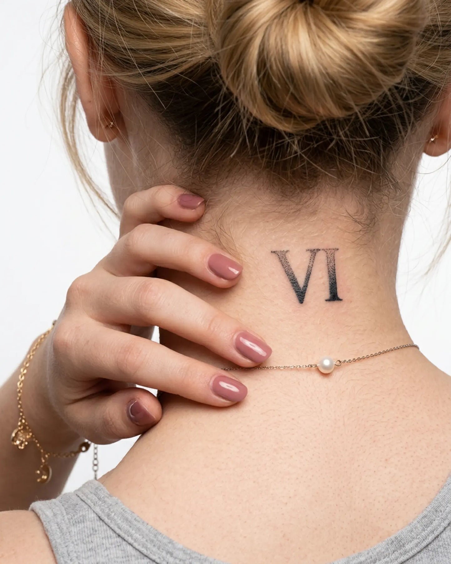 INKY Roman 6 semi-permanent tattoo applied on a woman – 2 x 2 in (4x4 cm) design, realistic ink look, lasts 10 days