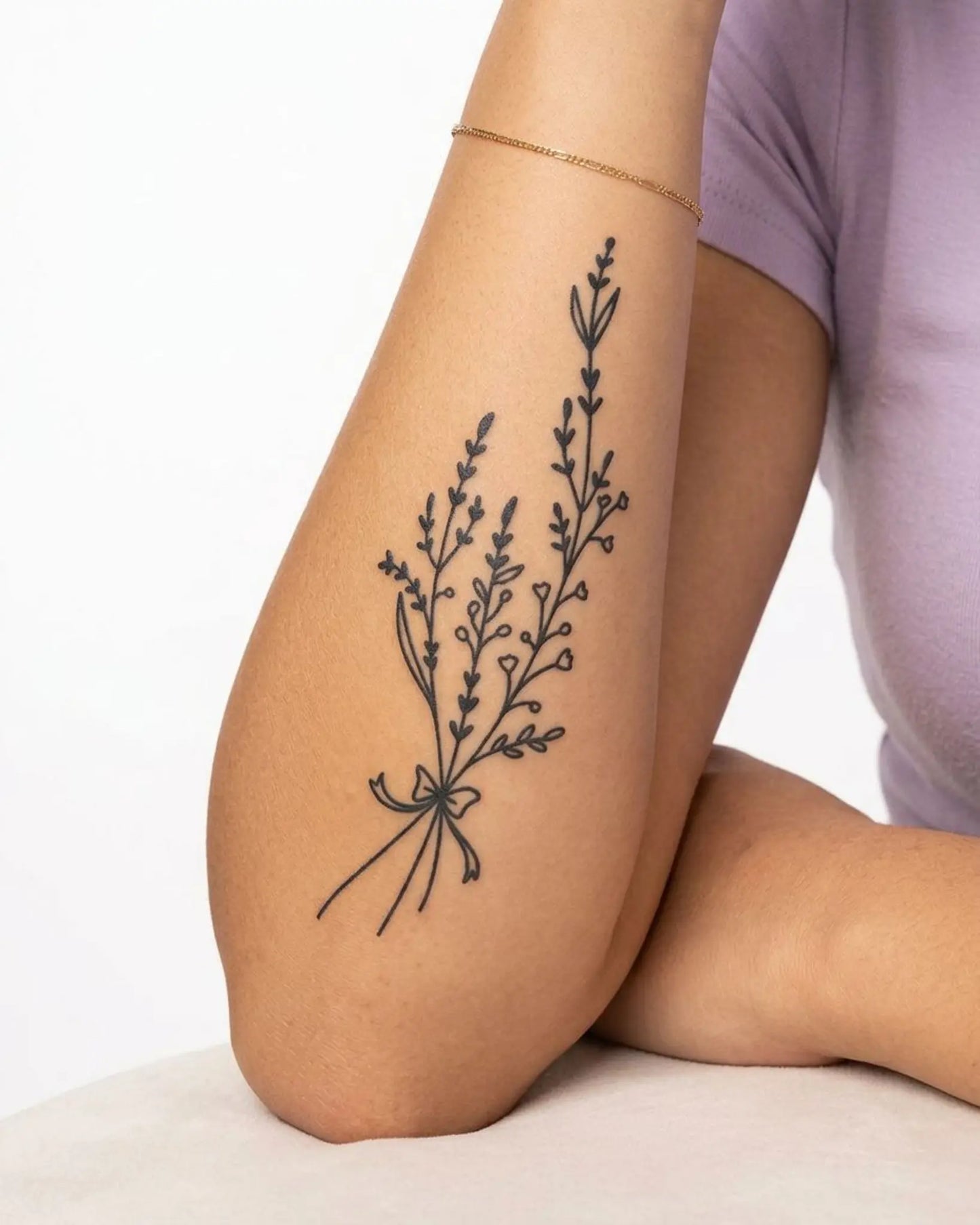 INKY Floral Sprig semi-permanent tattoo applied on a woman – 4 x 7 in (10x17 cm) design, realistic ink look, lasts 10 days