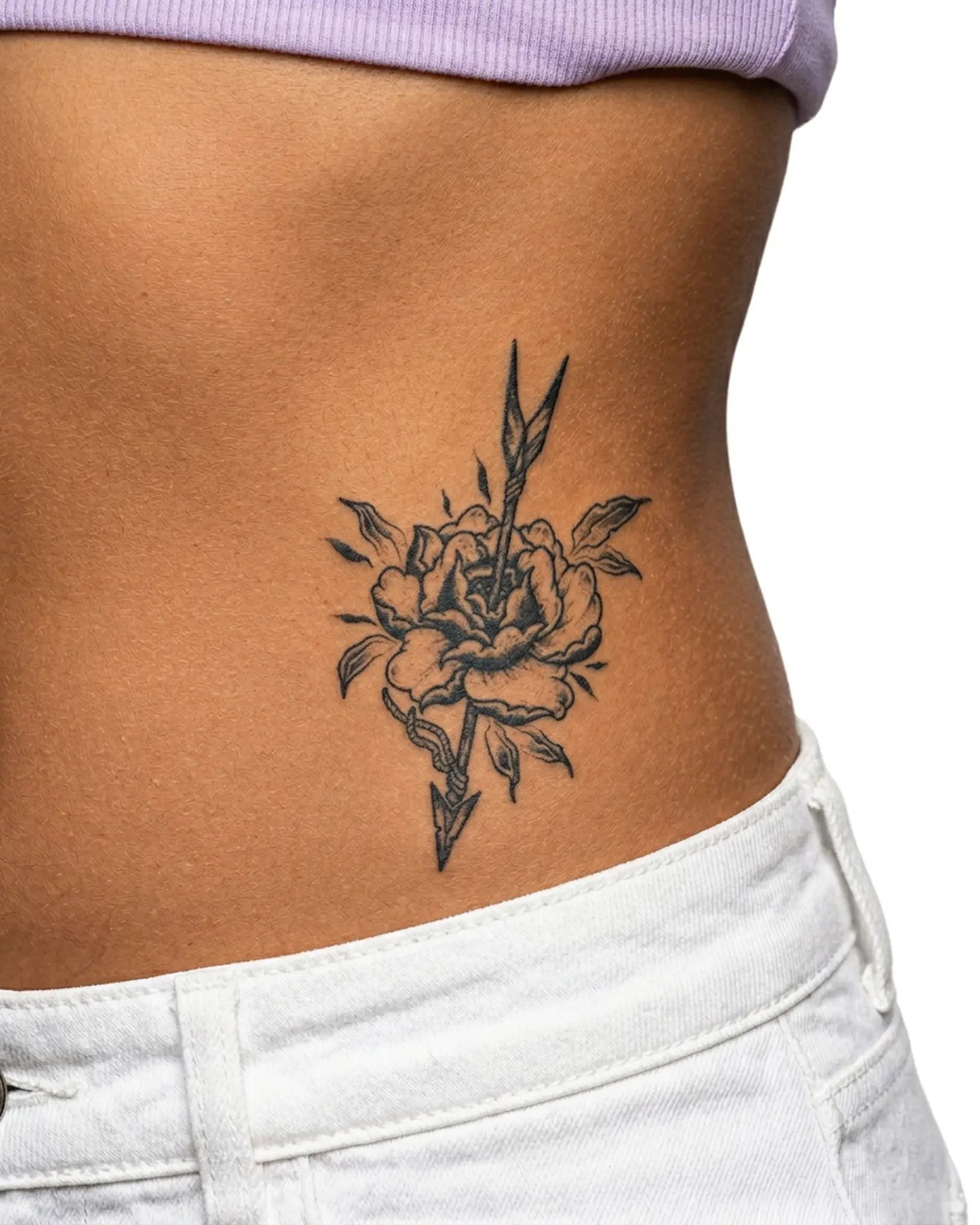 INKY Floral Arrow semi-permanent tattoo applied on a woman – 3 x 4 in (7x10 cm) design, realistic ink look, lasts 10 days