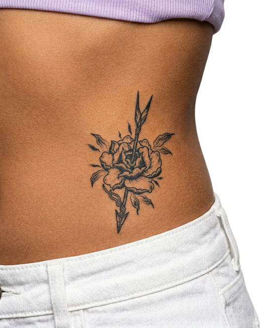 INKY Floral Arrow semi-permanent tattoo applied on a woman – 3 x 4 in (7x10 cm) design, realistic ink look, lasts 10 days