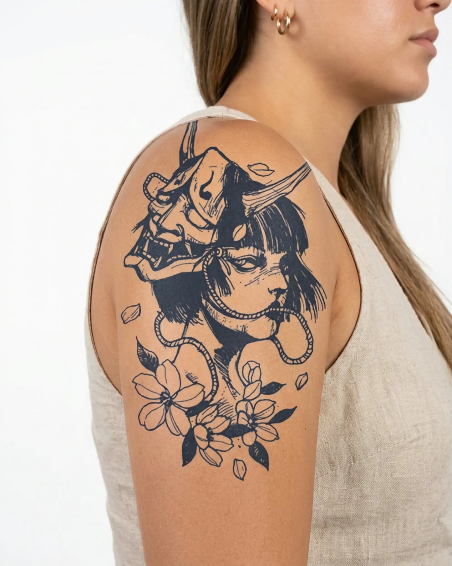 INKY Oni Blossom semi-permanent tattoo applied on a woman – 4 x 7 in (10x17 cm) design, realistic ink look, lasts 10 days