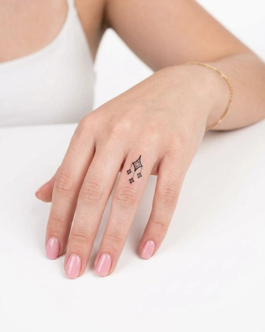 INKY Gem Drop semi-permanent tattoo applied on a woman – 0.5 x 0.5 in (1x1 cm) design, realistic ink look, lasts 10 days