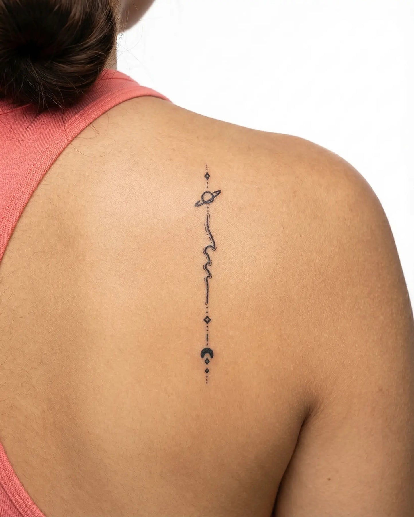 INKY Planet Moon semi-permanent tattoo applied on a woman – 2 x 4 in (6x10 cm) design, realistic ink look, lasts 10 days