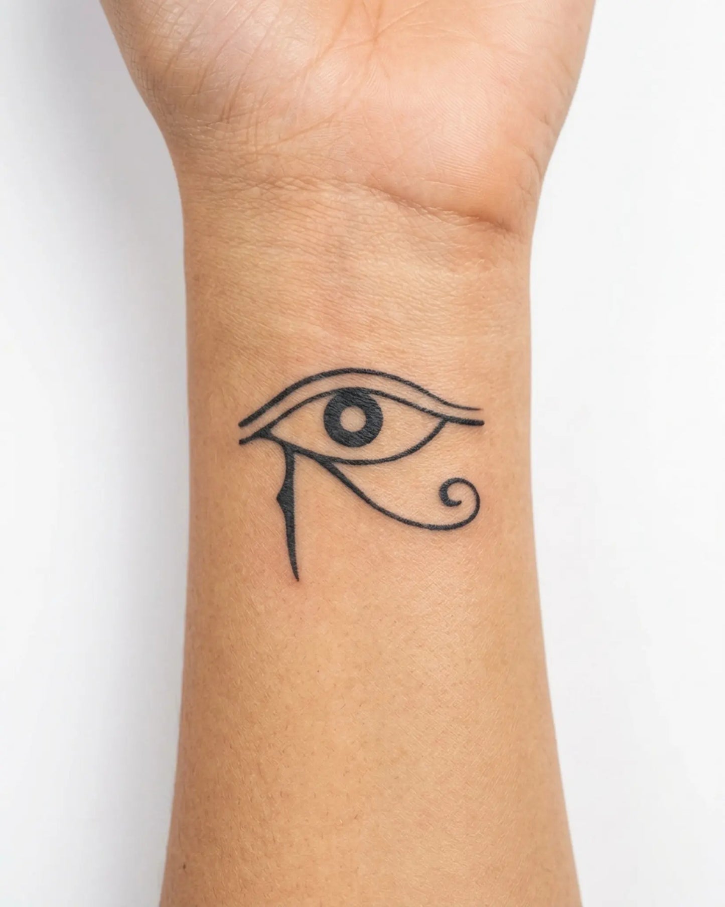 INKY Eye of Horus semi-permanent tattoo applied on a woman – 2 x 2 in (4x4 cm) design, realistic ink look, lasts 10 days