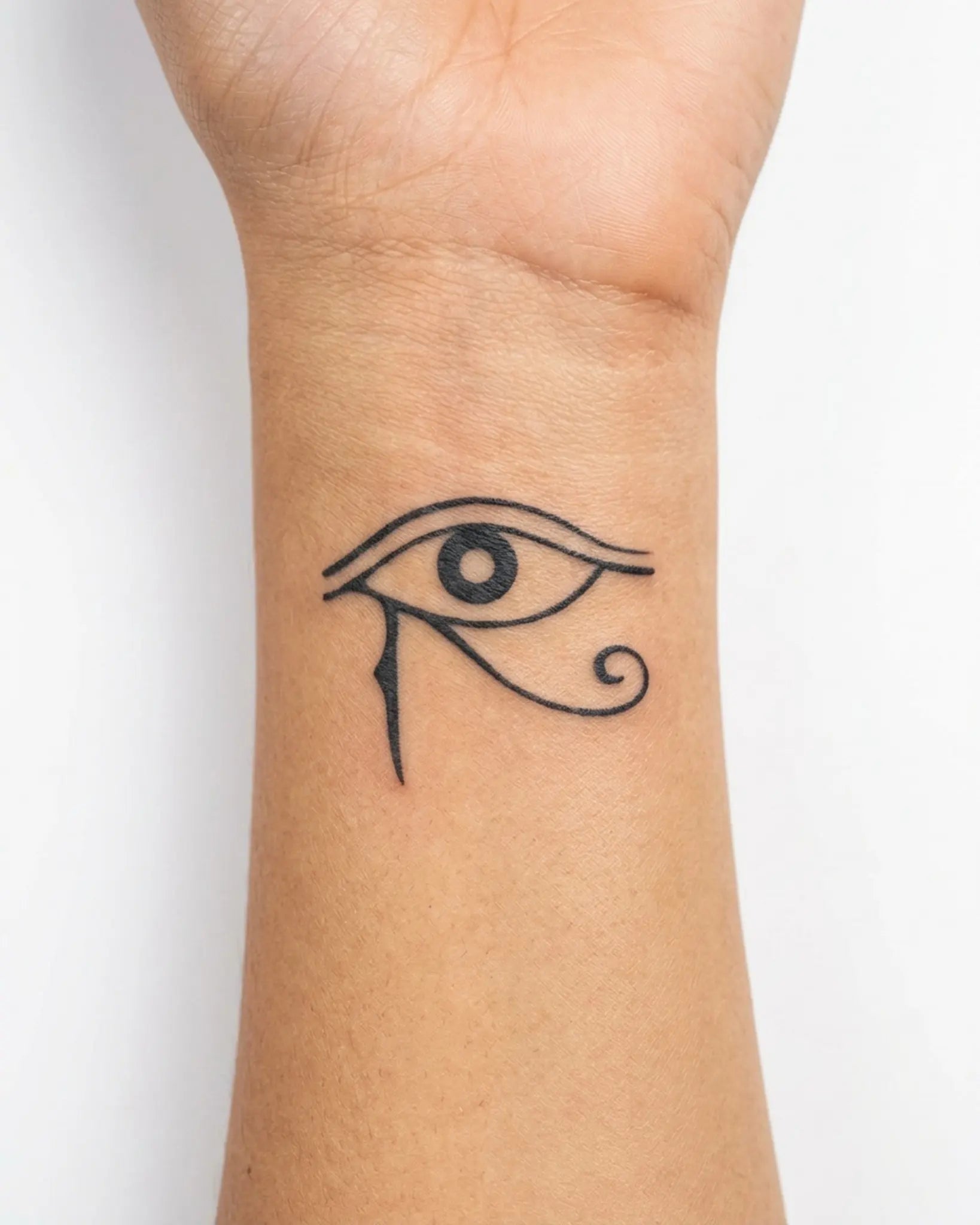 INKY Eye of Horus semi-permanent tattoo applied on a woman – 2 x 2 in (4x4 cm) design, realistic ink look, lasts 10 days