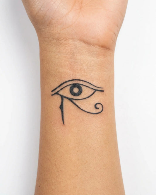 INKY Eye of Horus semi-permanent tattoo applied on a woman – 2 x 2 in (4x4 cm) design, realistic ink look, lasts 10 days