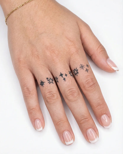 INKY Star Sparkles semi-permanent tattoo applied on a woman – 2 x 4 in (6x10 cm) design, realistic ink look, lasts 10 days