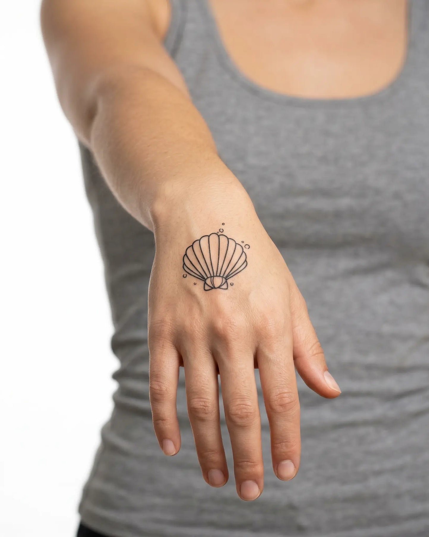 INKY Sea Bubble semi-permanent tattoo applied on a woman – 2 x 2 in (4x4 cm) design, realistic ink look, lasts 10 days