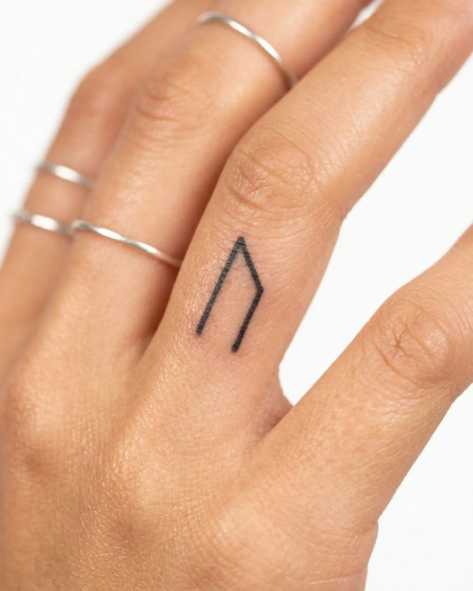 INKY N Rune semi-permanent tattoo applied on a woman – 0.5 x 0.5 in (1x1 cm) design, realistic ink look, lasts 10 days