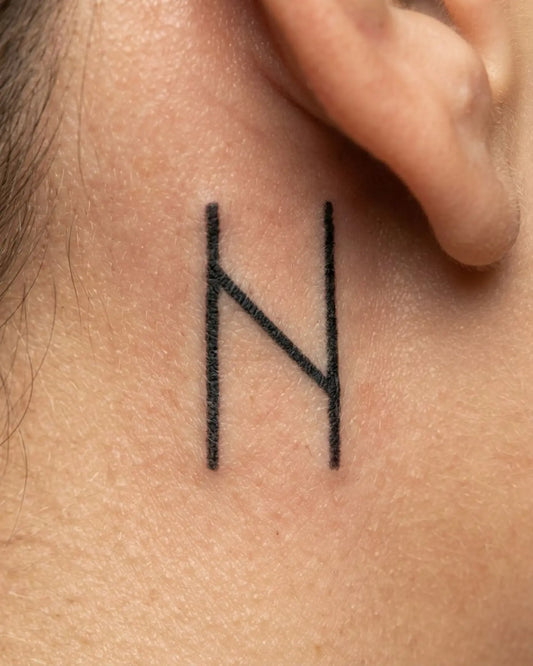 INKY Rune N semi-permanent tattoo applied on a woman – 0.5 x 0.5 in (1x1 cm) design, realistic ink look, lasts 10 days