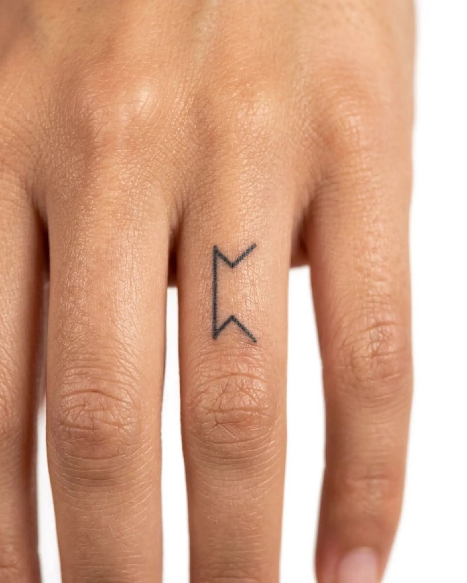 INKY Berkana Rune semi-permanent tattoo applied on a woman – 0.5 x 0.5 in (1x1 cm) design, realistic ink look, lasts 10 days