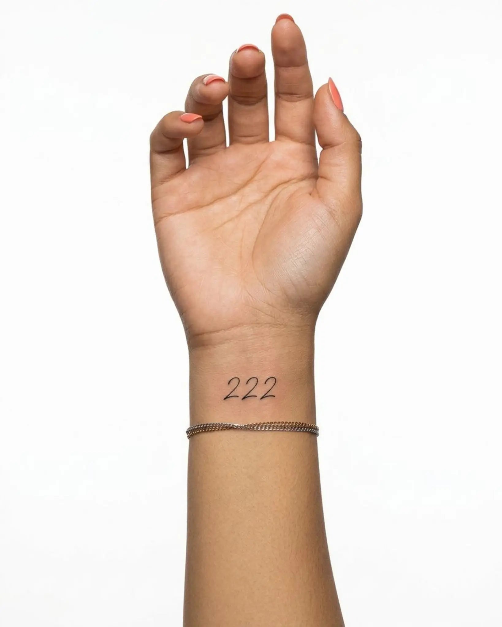 INKY Angel 222 semi-permanent tattoo applied on a woman – 2 x 2 in (4x4 cm) design, realistic ink look, lasts 10 days