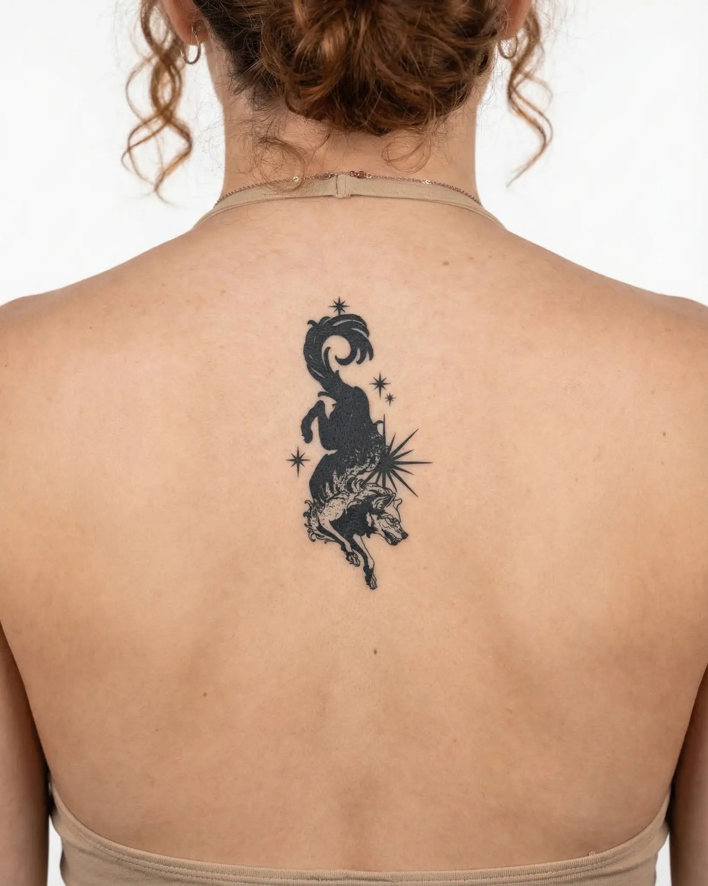 INKY Star Wolf semi-permanent tattoo applied on a woman – 2 x 4 in (6x10 cm) design, realistic ink look, lasts 10 days