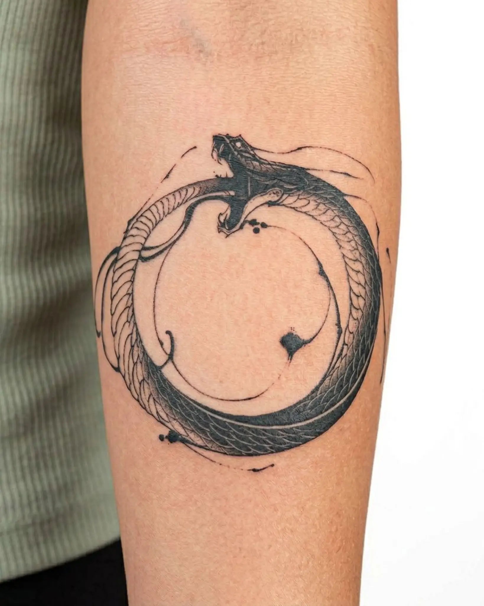 INKY Serpent Ring semi-permanent tattoo applied on a woman – 3 x 3 in (7x7 cm) design, realistic ink look, lasts 10 days