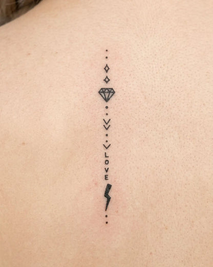 INKY Love Bolt semi-permanent tattoo applied on a woman – 2 x 4 in (6x10 cm) design, realistic ink look, lasts 10 days