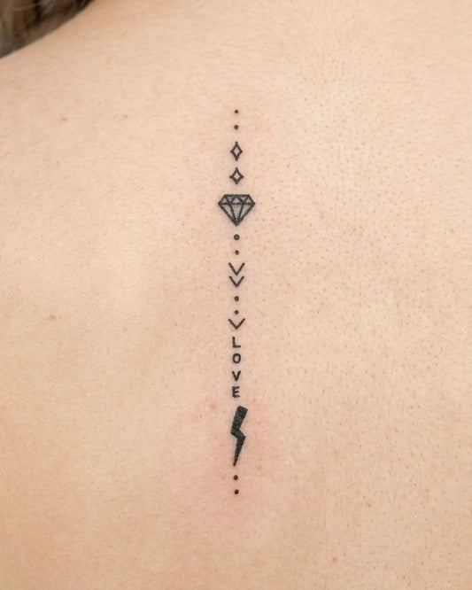 INKY Love Bolt semi-permanent tattoo applied on a woman – 2 x 4 in (6x10 cm) design, realistic ink look, lasts 10 days