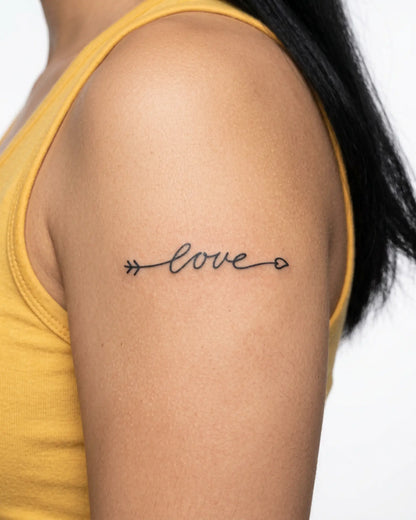 INKY Love Arrow 2 semi-permanent tattoo applied on a woman – 3 x 3 in (7x7 cm) design, realistic ink look, lasts 10 days