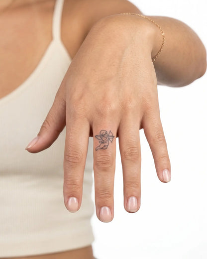 INKY Love Archer semi-permanent tattoo applied on a woman – 0.5 x 0.5 in (1x1 cm) design, realistic ink look, lasts 10 days