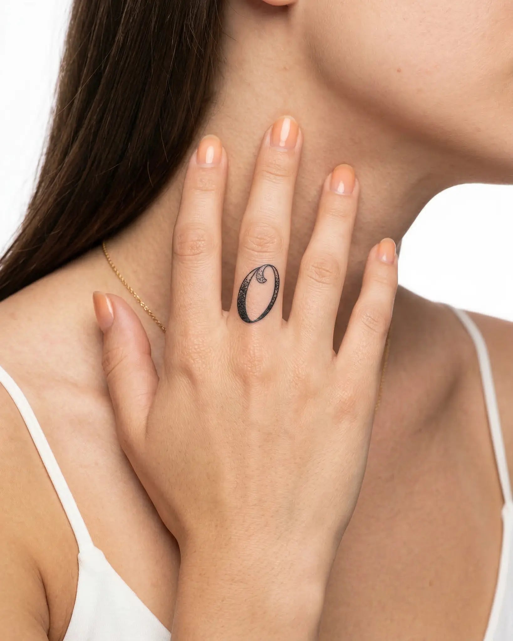 INKY Dotwork 0 semi-permanent tattoo applied on a woman – 0.5 x 0.5 in (1x1 cm) design, realistic ink look, lasts 10 days