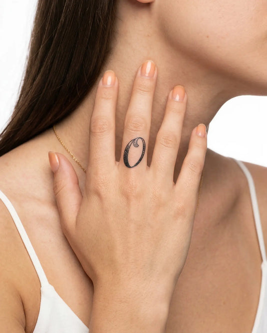 INKY Dotwork 0 semi-permanent tattoo applied on a woman – 0.5 x 0.5 in (1x1 cm) design, realistic ink look, lasts 10 days