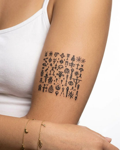 INKY Mystic Glyphs 2 semi-permanent tattoo applied on a woman – 3 x 3 in (7x7 cm) design, realistic ink look, lasts 10 days