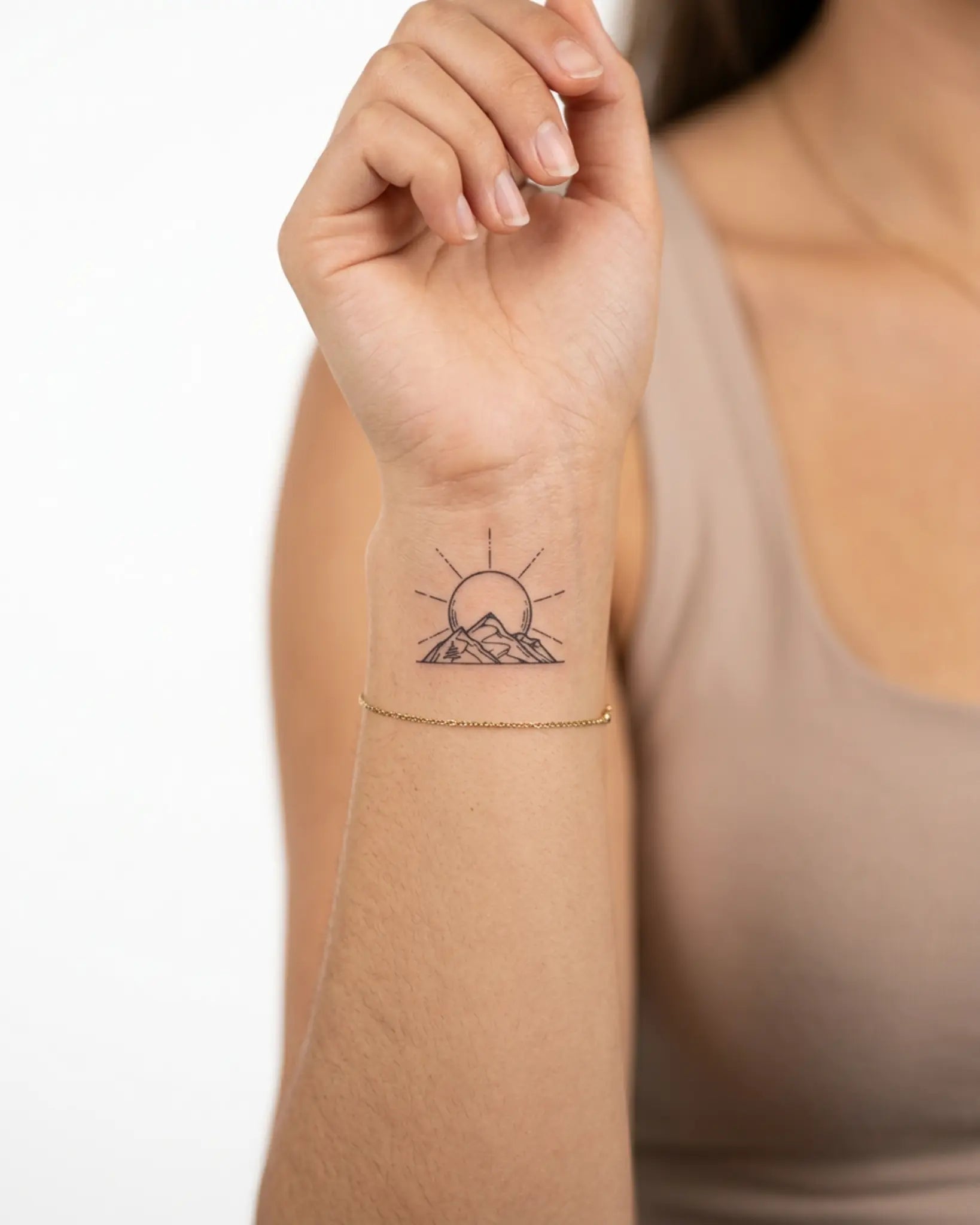INKY Mountain Sun 2 semi-permanent tattoo applied on a woman – 2 x 2 in (4x4 cm) design, realistic ink look, lasts 10 days