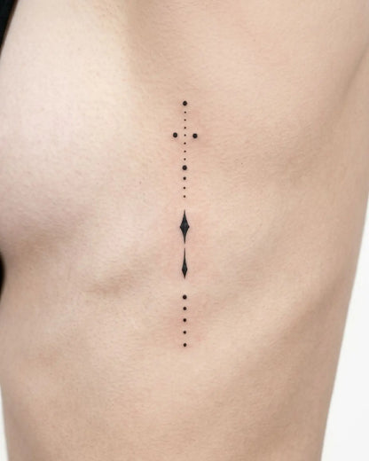INKY Spirit Line 2 semi-permanent tattoo applied on a woman – 2 x 4 in (6x10 cm) design, realistic ink look, lasts 10 days