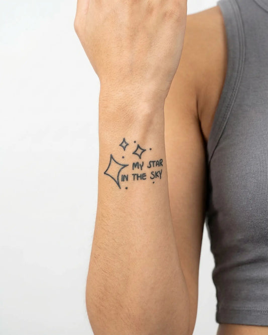 INKY Star In Sky semi-permanent tattoo applied on a woman – 2 x 2 in (4x4 cm) design, realistic ink look, lasts 10 days