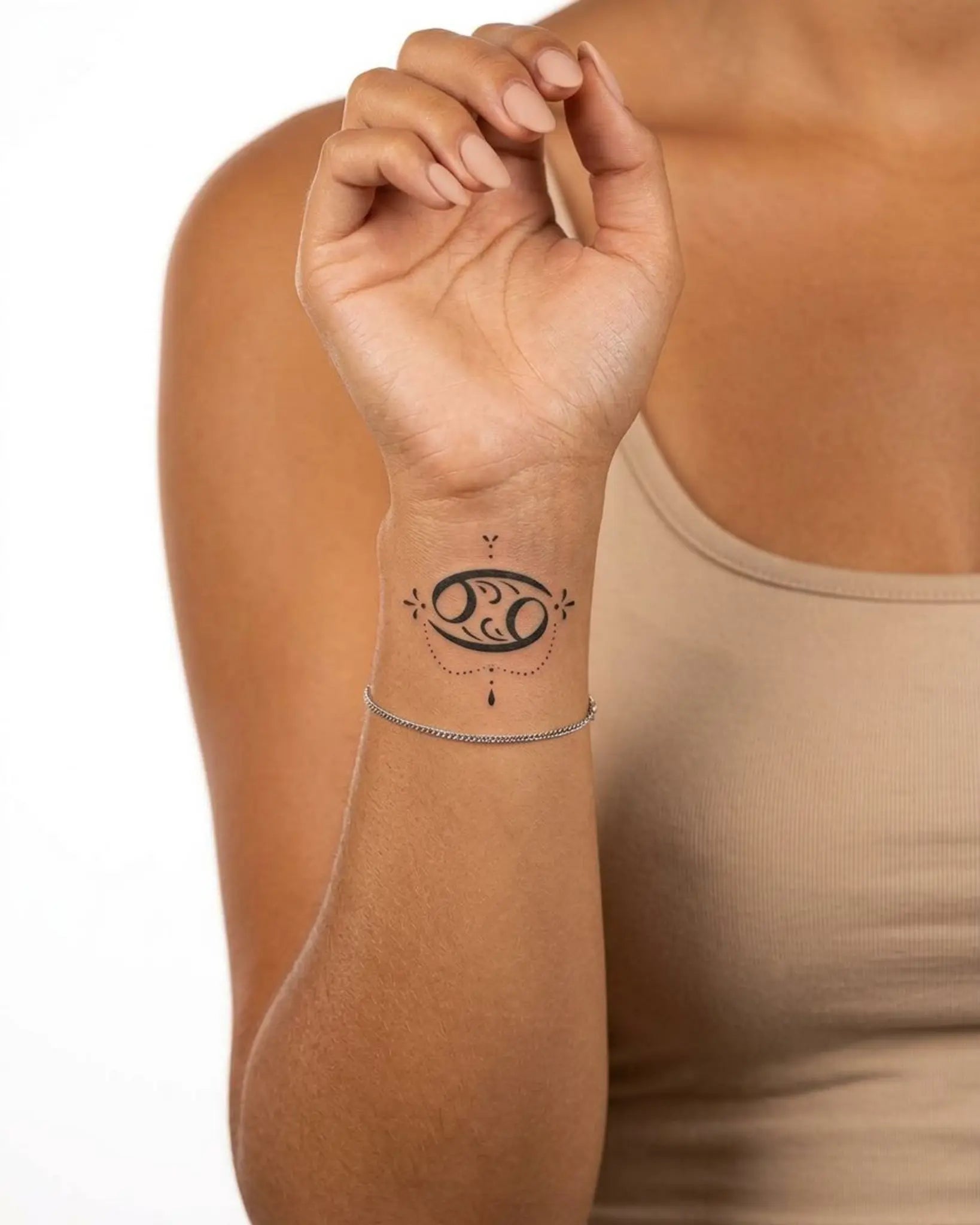 INKY Cancer Charm semi-permanent tattoo applied on a woman – 2 x 2 in (4x4 cm) design, realistic ink look, lasts 10 days